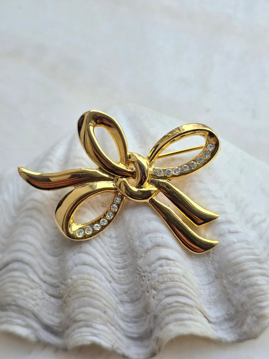 Vintažinė aukso spalvos sagė bantukas