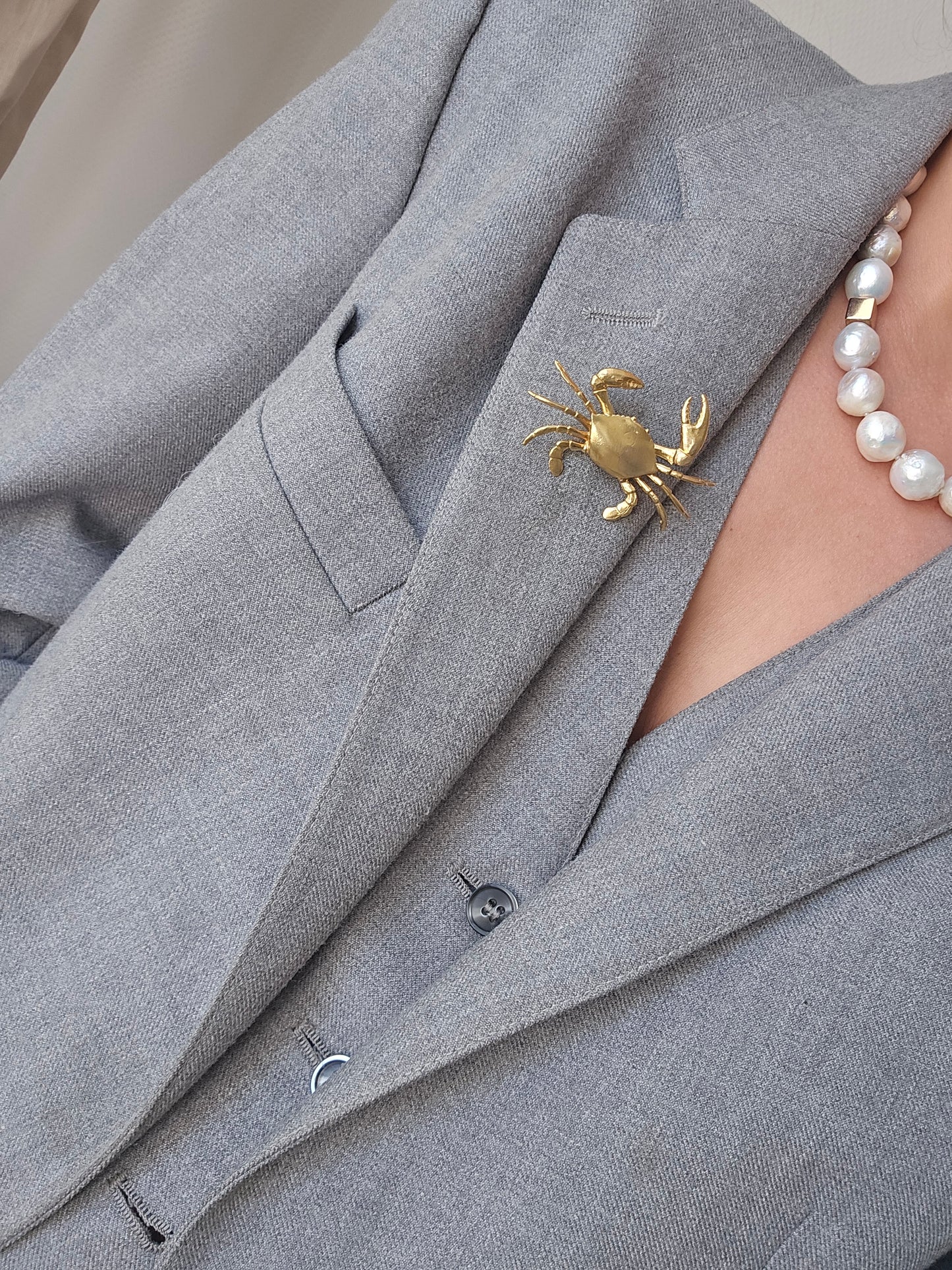Gold-colored crab brooch pin