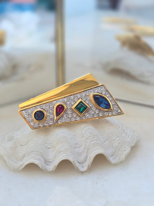 Vintažinė aukso spalvos sagė su spalvotais stiklo kristalais