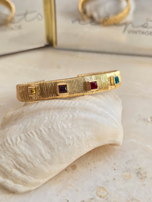 Aukso spalvos apyrankė su stiklo kristalais