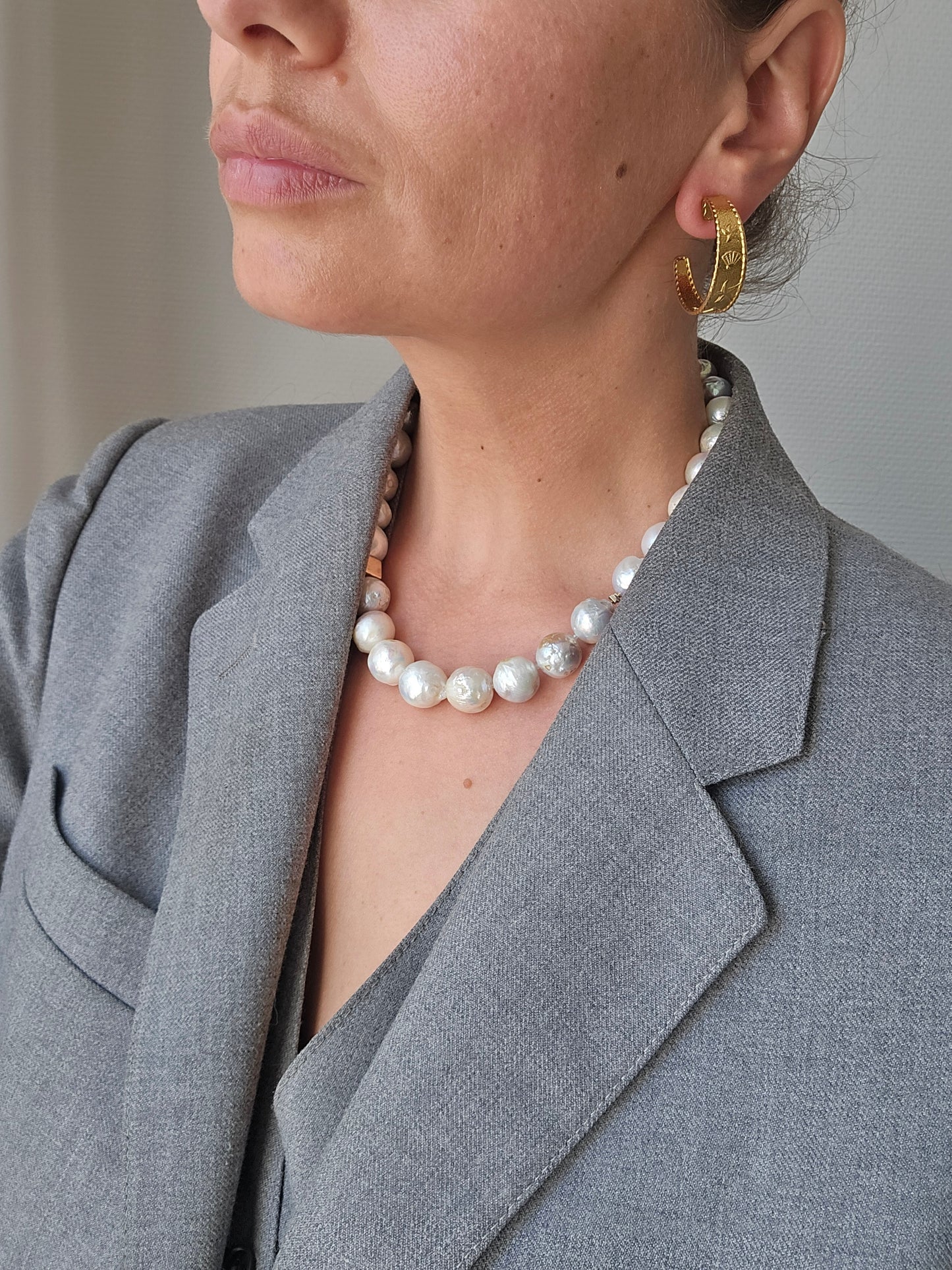 Gold-colored hoop earrings