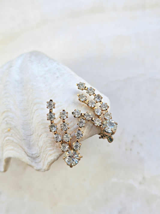 Vintažiniai sendinto aukso spalvos klipsai kometos